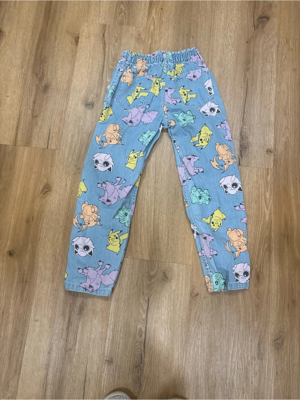 H&M Pokémon Print light denim relaxed fit paper bag Jean. Size 10